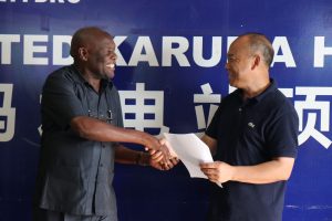 Minister-of-state-for-energy-issues-certificate-of-completion-for-Karuma-HPP-1